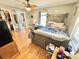 Comfortable main bedroom with a barn wood headboard, ensuite bath, and hardwood floors at 533 Tuckers Grove Rd, Statesville, NC 28625