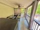 Relaxing screened-in patio with a seating area and ceiling fan offers an outdoor retreat at 533 Tuckers Grove Rd, Statesville, NC 28625