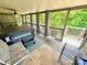 Relaxing screened-in patio with a hot tub and ceiling fan offers an outdoor retreat at 533 Tuckers Grove Rd, Statesville, NC 28625