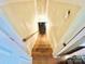 Stairwell with wooden stairs and white walls provides access to upper and lower levels at 533 Tuckers Grove Rd, Statesville, NC 28625