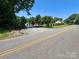 Street view of the home showcasing the property's serene surroundings and curb appeal at 533 Tuckers Grove Rd, Statesville, NC 28625