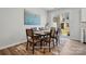 Bright dining area with a sliding glass door and backyard view, next to the kitchen at 7148 Hodges Meadow Ln, Charlotte, NC 28213