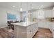 Bright kitchen showcases a center island, sleek countertops, and an adjacent dining area at 7148 Hodges Meadow Ln, Charlotte, NC 28213