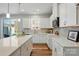 Modern kitchen features white cabinets, stainless steel appliances, and ample counter space at 7148 Hodges Meadow Ln, Charlotte, NC 28213
