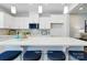 Chic kitchen features a large island with bar seating, perfect for entertaining guests at 7148 Hodges Meadow Ln, Charlotte, NC 28213