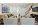 Bright living room showcases a staircase, sleek furnishings, and inviting decor at 7148 Hodges Meadow Ln, Charlotte, NC 28213