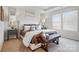 Elegant main bedroom featuring a luxurious bed, neutral tones, and plenty of natural light at 7148 Hodges Meadow Ln, Charlotte, NC 28213