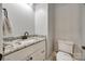 Powder room featuring vanity with granite countertop and modern fixtures at 7435 Hammond Dr, Charlotte, NC 28215