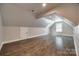 Spacious bonus room with hardwood flooring, recessed lighting, and ample natural light at 7435 Hammond Dr, Charlotte, NC 28215