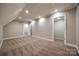 Spacious bonus room with new carpeting, recessed lighting, and access to another room at 7435 Hammond Dr, Charlotte, NC 28215