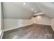 Large bonus room featuring hardwood floors, recessed lighting, and a neutral color palette at 7435 Hammond Dr, Charlotte, NC 28215