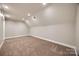 Bright bonus room with recessed lighting, neutral paint, and plush carpeting at 7435 Hammond Dr, Charlotte, NC 28215