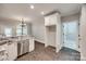 Kitchen view with stainless steel dishwasher, white cabinets, and granite countertops at 7435 Hammond Dr, Charlotte, NC 28215