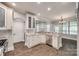 Kitchen featuring white cabinets, granite countertops, and stainless steel appliances at 7435 Hammond Dr, Charlotte, NC 28215