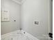Laundry room with tile floors and washer/dryer hookups at 7435 Hammond Dr, Charlotte, NC 28215