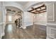 Spacious living room with hardwood floors, coffered ceiling, and elegant archways at 7435 Hammond Dr, Charlotte, NC 28215