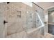 Modern bathroom shower featuring decorative tilework, a glass enclosure, and dual shower heads at 7435 Hammond Dr, Charlotte, NC 28215