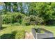 This beautiful backyard featuring a vegetable garden, mature bushes, and a tranquil setting at 7504 Petrea Ln, Charlotte, NC 28227