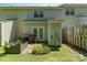 Charming backyard featuring a small garden, green grass, and privacy fence at 7504 Petrea Ln, Charlotte, NC 28227