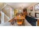 Open dining area featuring a wood table and stairs leading to the second floor at 7504 Petrea Ln, Charlotte, NC 28227