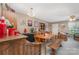 Open dining space with a chandelier and hardwood table at 7504 Petrea Ln, Charlotte, NC 28227