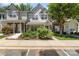 Charming townhome with manicured front yard, brick accents, and a welcoming entrance at 7504 Petrea Ln, Charlotte, NC 28227