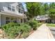 Well-maintained townhome with assigned parking, patriotic landscaping, and traditional exterior at 7504 Petrea Ln, Charlotte, NC 28227