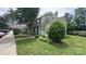 Charming townhome features a well-manicured lawn and traditional siding at 7504 Petrea Ln, Charlotte, NC 28227
