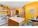 Open kitchen layout with island and white appliances at 7504 Petrea Ln, Charlotte, NC 28227