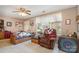 Neutral living room featuring a ceiling fan and a large window at 7504 Petrea Ln, Charlotte, NC 28227
