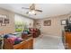 Neutral living area with a ceiling fan and natural light at 7504 Petrea Ln, Charlotte, NC 28227