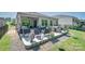 Large backyard featuring a patio with seating, a grill, and well-maintained landscaping at 7530 Porrera St, Charlotte, NC 28214