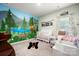 Cheerful Bedroom featuring a mountain wall mural, crib, sofa, natural light, and playful decor at 7530 Porrera St, Charlotte, NC 28214