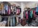 Spacious walk-in closet with extensive shelving, ample storage space, and hanging racks for clothes and accessories at 7530 Porrera St, Charlotte, NC 28214