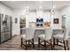 Modern kitchen with stainless steel appliances, a large island, and ample cabinet space at 7530 Porrera St, Charlotte, NC 28214