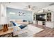 Inviting living room with a cozy sectional sofa, entertainment center, and modern decor at 7530 Porrera St, Charlotte, NC 28214