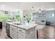 Spacious living area with a large island, seamless flow to the kitchen and dining area at 7530 Porrera St, Charlotte, NC 28214