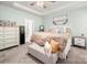 A view of the main bedroom, highlighting the en-suite bathroom, walk-in closet, and bedroom furniture at 7530 Porrera St, Charlotte, NC 28214