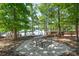 Picturesque picnic area with wooden picnic tables and grills near a lake, perfect for outdoor gatherings at 7530 Porrera St, Charlotte, NC 28214