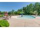A fun splashpad area with tables, umbrellas, and chairs is ideal for hot days at 7530 Porrera St, Charlotte, NC 28214