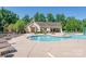 Enjoy this community pool with shallow entry, chairs, umbrellas, and adjacent pavilion at 7530 Porrera St, Charlotte, NC 28214