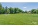 Vast community recreational field with soccer goal, playground area and lush green lawn at 7530 Porrera St, Charlotte, NC 28214