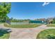 Community tennis courts featuring well maintained courts surrounded by manicured lawns and a clear blue sky at 7530 Porrera St, Charlotte, NC 28214