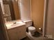 Bathroom featuring a vanity with a sink and a toilet at 7608 Surreywood Pl, Charlotte, NC 28270