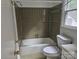 Bathroom featuring a shower-tub combination and a classic toilet at 7608 Surreywood Pl, Charlotte, NC 28270