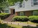 Charming two-story home with brick and siding, featuring a well-maintained front yard and inviting entryway at 7608 Surreywood Pl, Charlotte, NC 28270