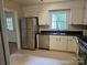 Classic kitchen offers stainless steel appliances and plenty of cabinet space providing functionality and style at 7608 Surreywood Pl, Charlotte, NC 28270