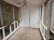 Screened-in porch with a white door and wooden blinds at 7608 Surreywood Pl, Charlotte, NC 28270