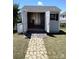 Backyard shed on a stone path featuring double doors at 8406 Flint Hill Dr, Charlotte, NC 28273
