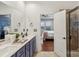Bathroom featuring a double vanity and access to the shower and main bedroom at 8406 Flint Hill Dr, Charlotte, NC 28273